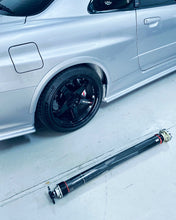 Load image into Gallery viewer, Supertec Racing Carbon Fibre Lightweight Driveshaft - For Nissan Skyline R32 GTR, R33 GTR, R34 GTR. Weight approx 7.6kg. Also available for Getrag gearbox conversion and also BMW DCT conversions. 8HP also possible. 